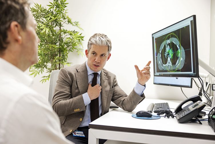 A photograph of Dr James Wilson describing state-of-the-art cancer treatment in London's best private hospitals